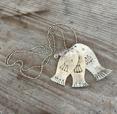 Handcrafted string of fish necklace made from upcycled vintage silverware spoons called Today's Catch - premium artisan jewelry