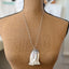 Eco-friendly upcycled vintage spoon fish statement necklace with rose quartz modeled on mannequin - handmade artisan jewelry