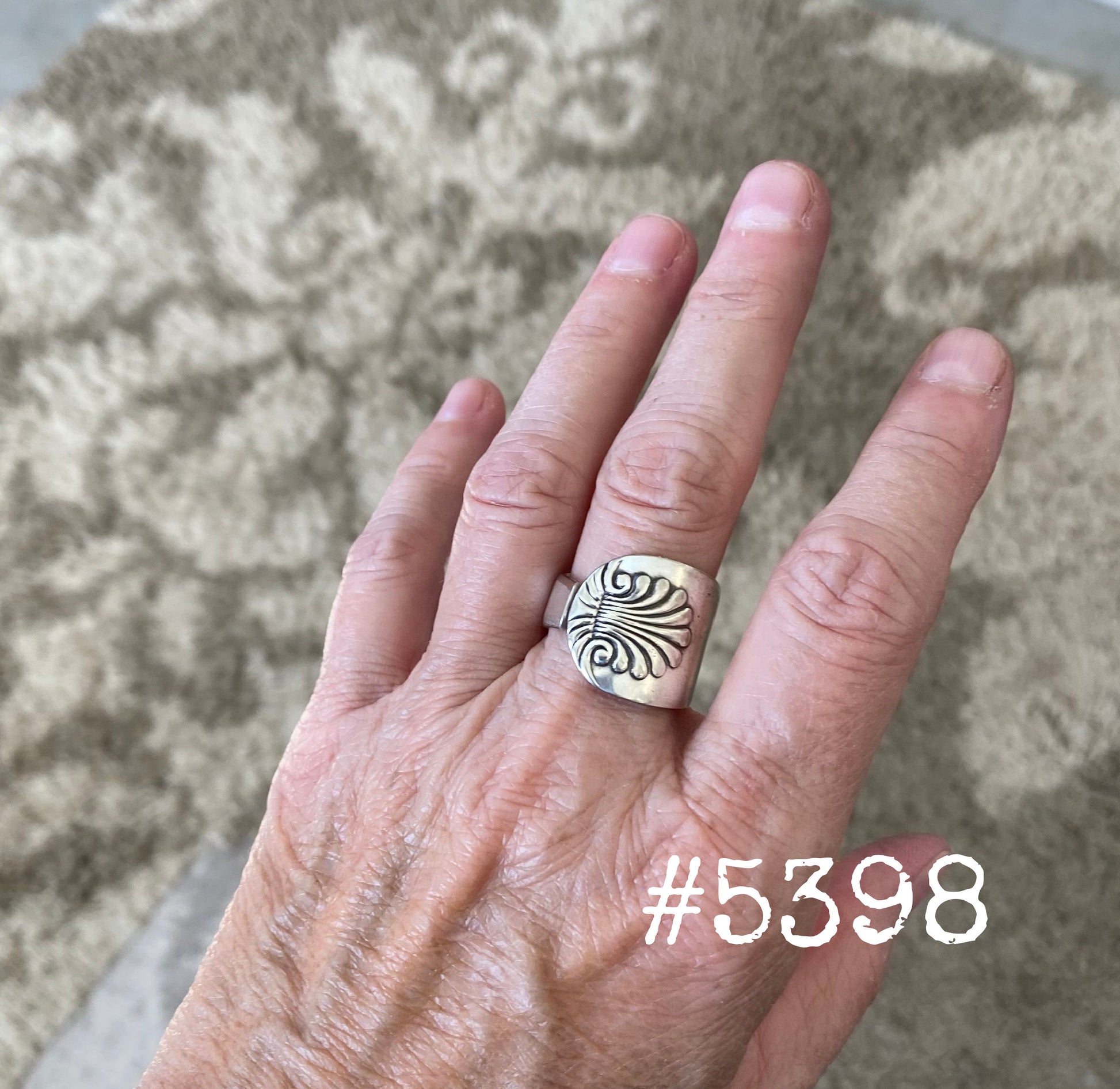 Handmade Shell spoon ring worn on finger displaying size and fit of upcycled silverware ring