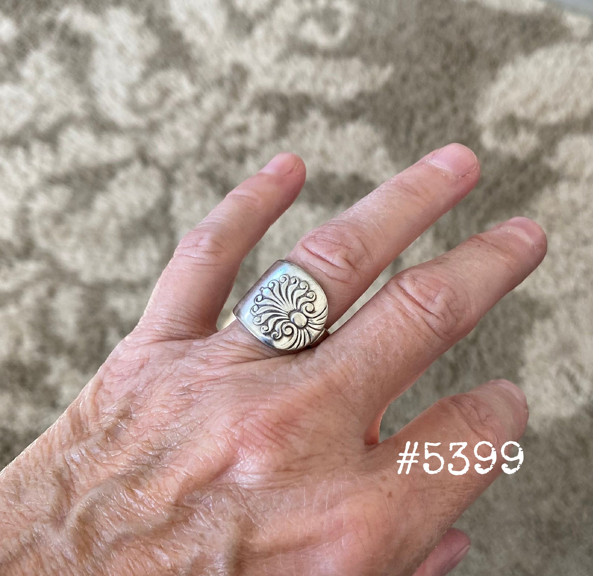 Shell Silverware ring shown on finger displaying size and fit of upcycled spoon ring