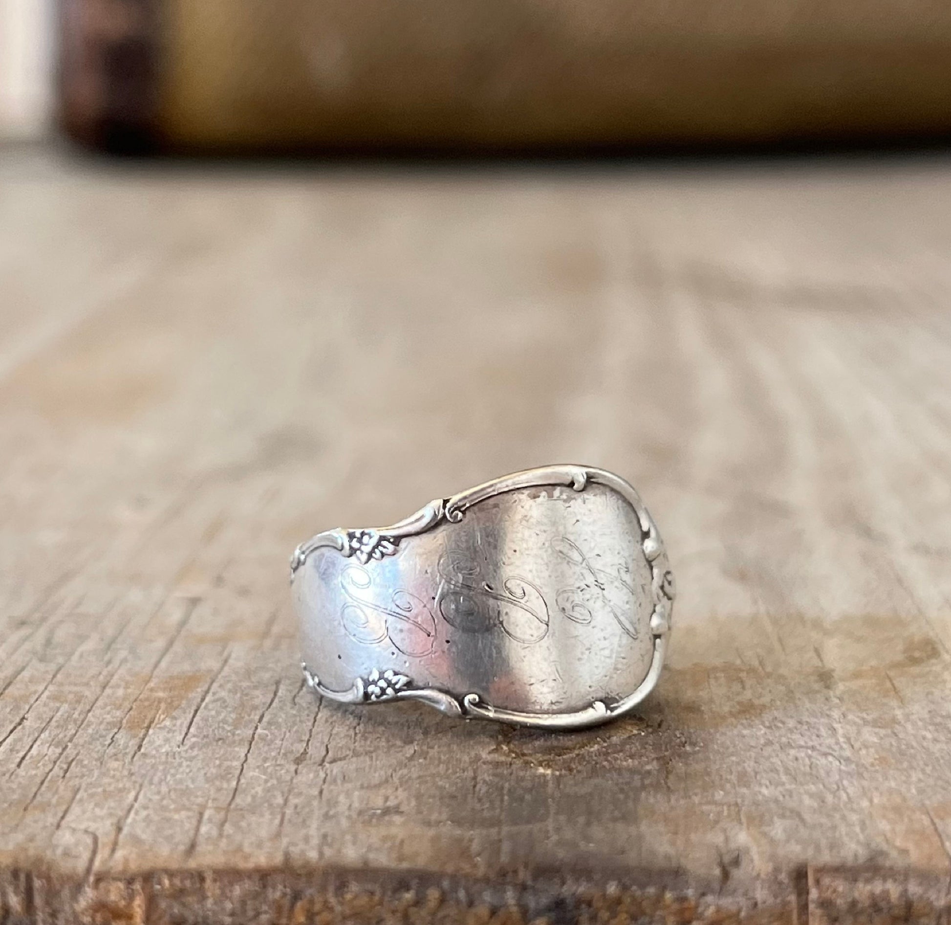 Close up of sterling silver Mignonette spoon ring showing Lunt baby spoon pattern with original monogram
