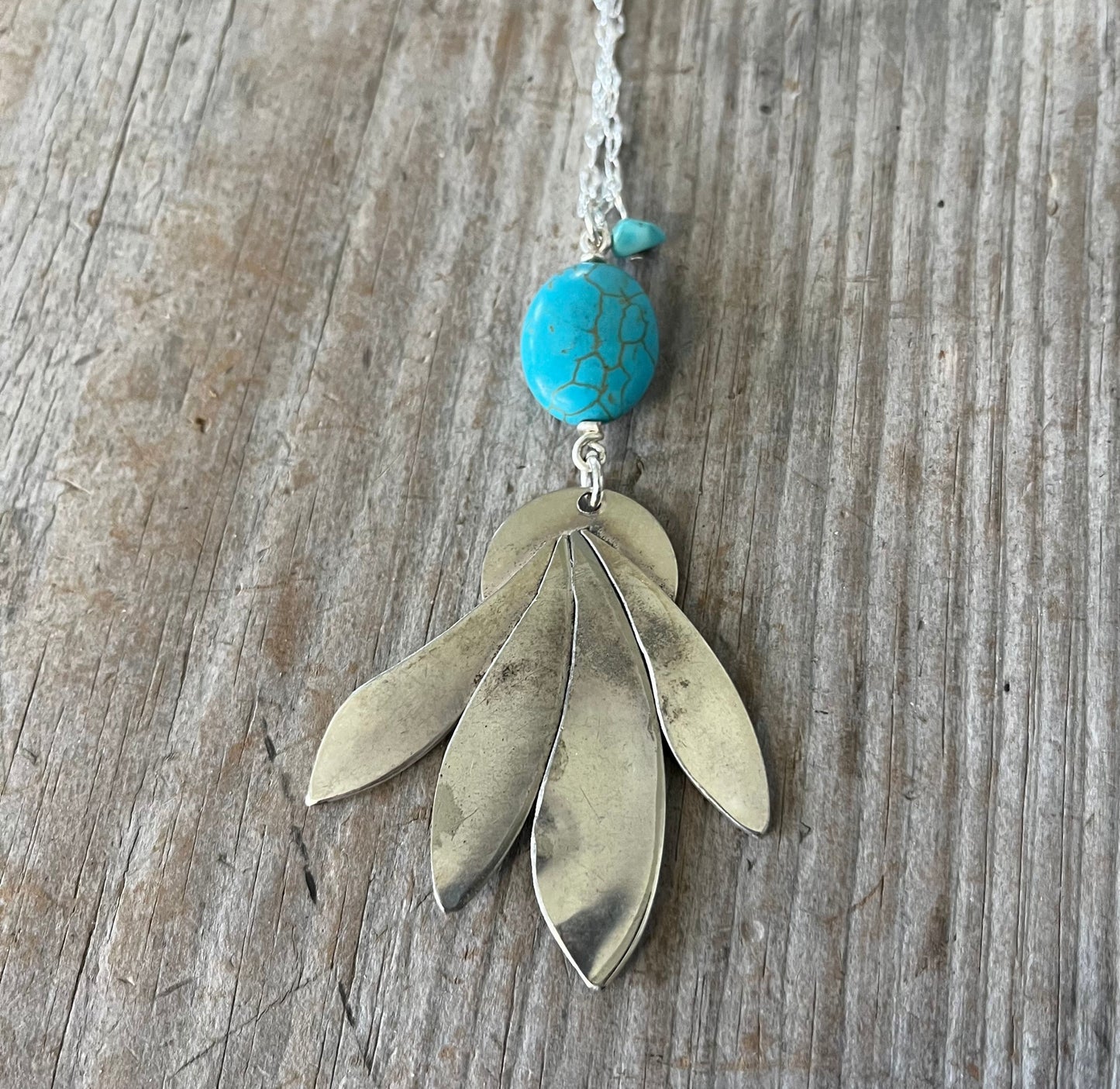 Backside of handcrafted feathery spoon pendant with stone accents - unique upcycled vintage silverware artisan necklace
