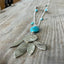 Close-up detail of vintage spoon pendant with stone accents - handcrafted southwestern upcycled artisan silverware necklace