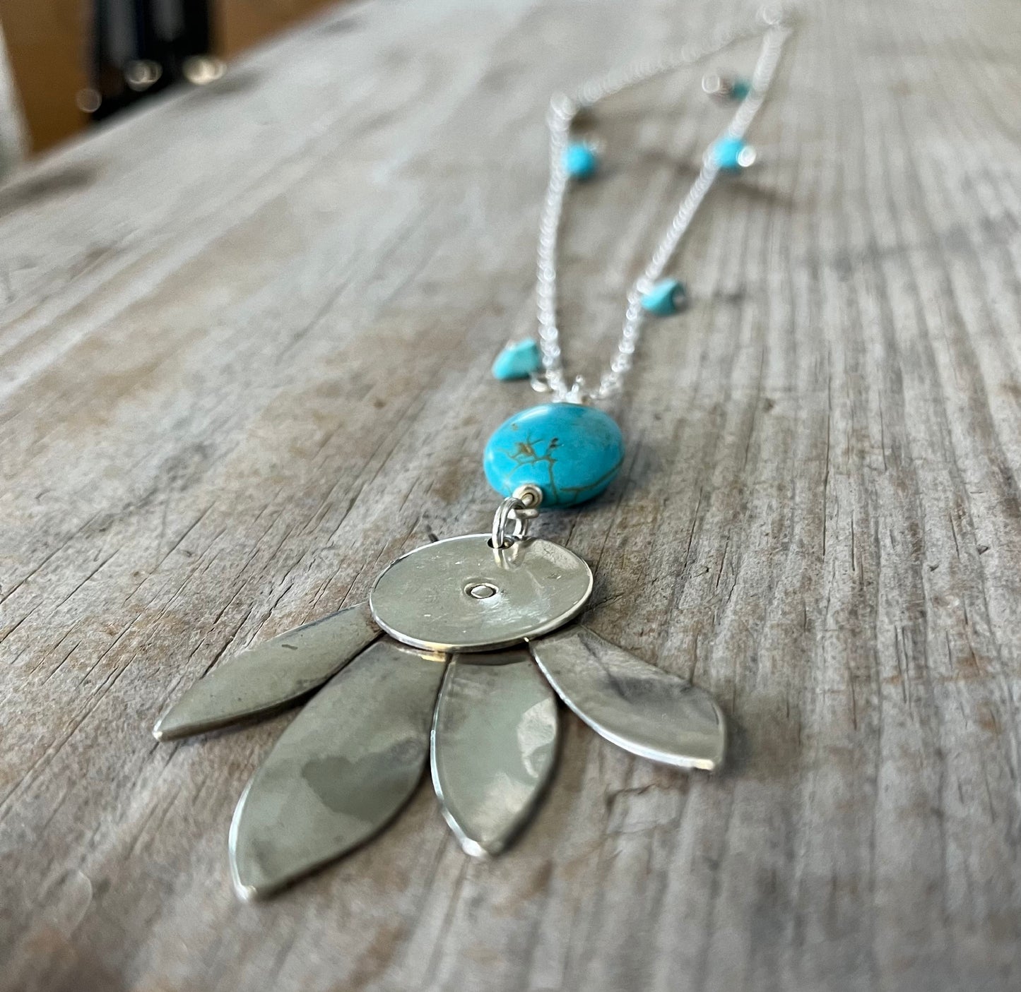 Close-up detail of vintage spoon pendant with stone accents - handcrafted southwestern upcycled artisan silverware necklace