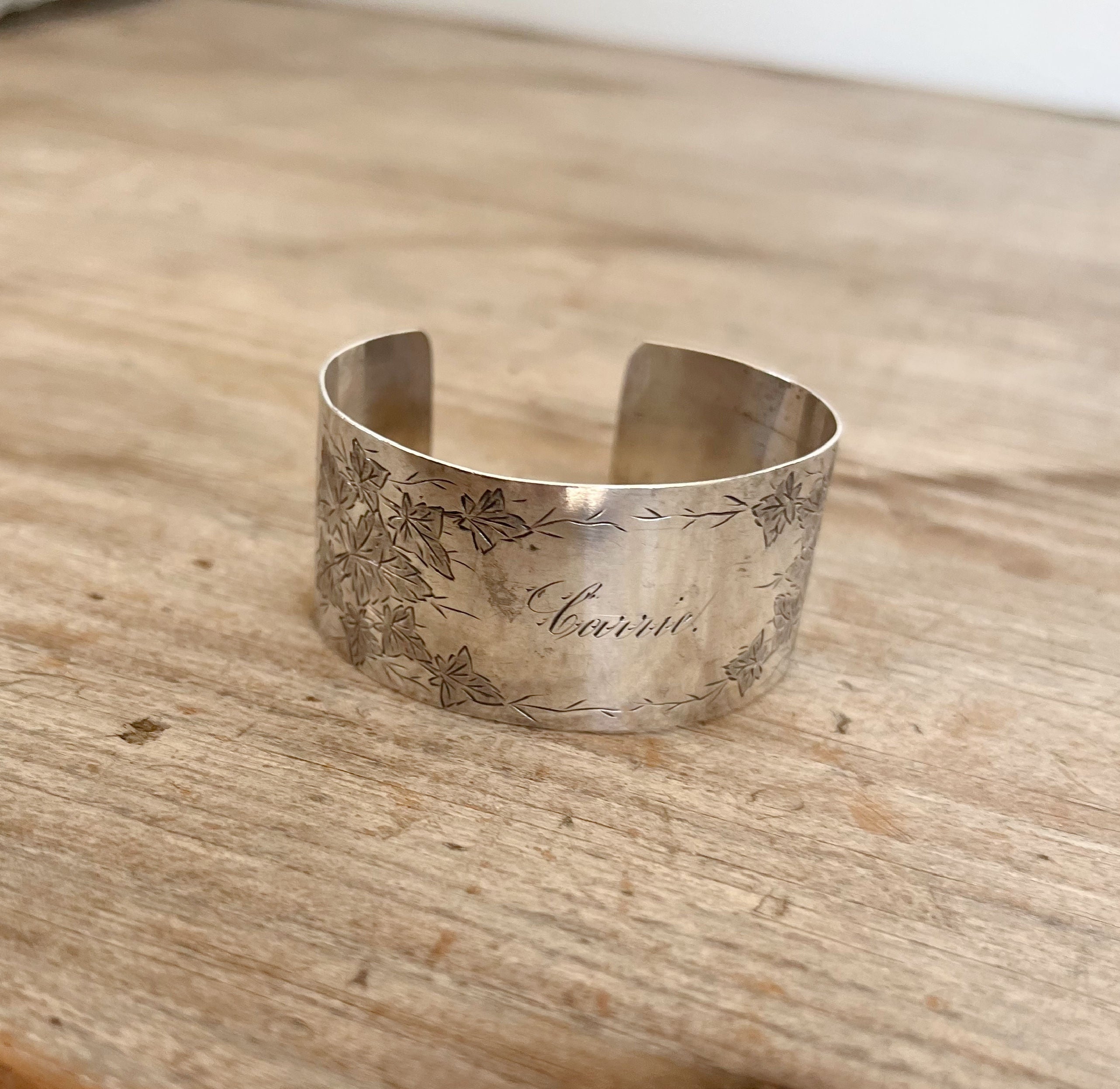 Sterling silver napkin ring cuff bracelet with Victorian ivy vine pattern and CARRIE script monogram