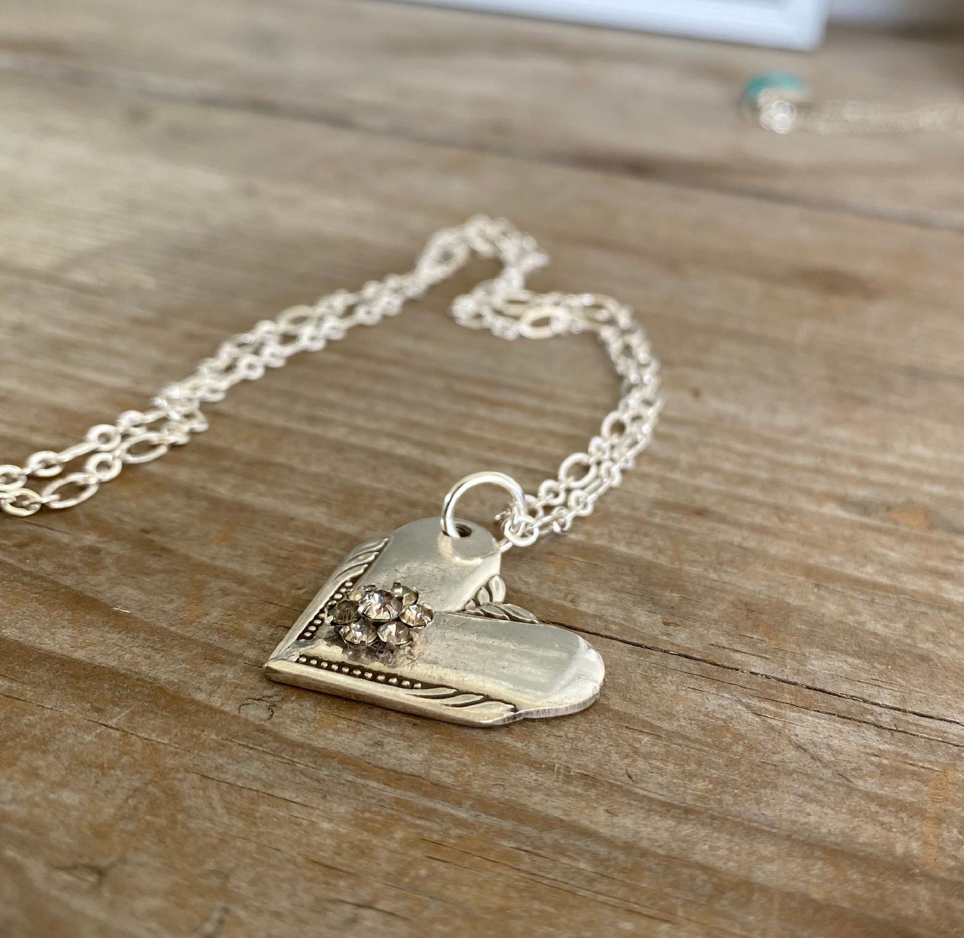 Vintage spoon heart necklace made from upcycled 1939 William Rogers Hiawatha silverplate handles with rhinestone flower accent, handcrafted jewelry