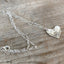 Upcycled Hiawatha pattern spoon heart necklace on 22-inch silverplate loop chain, one-of-a-kind handmade vintage silverware jewelry