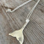 Close-up of upcycled teaspoon mermaid tail pendant measuring 2-3/8 inches with large cultured pearl bead, handcrafted beach jewelry