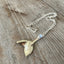 Upcycled vintage silverware mermaid tail necklace styled to show pendant drape, sustainable handmade ocean-inspired jewelry