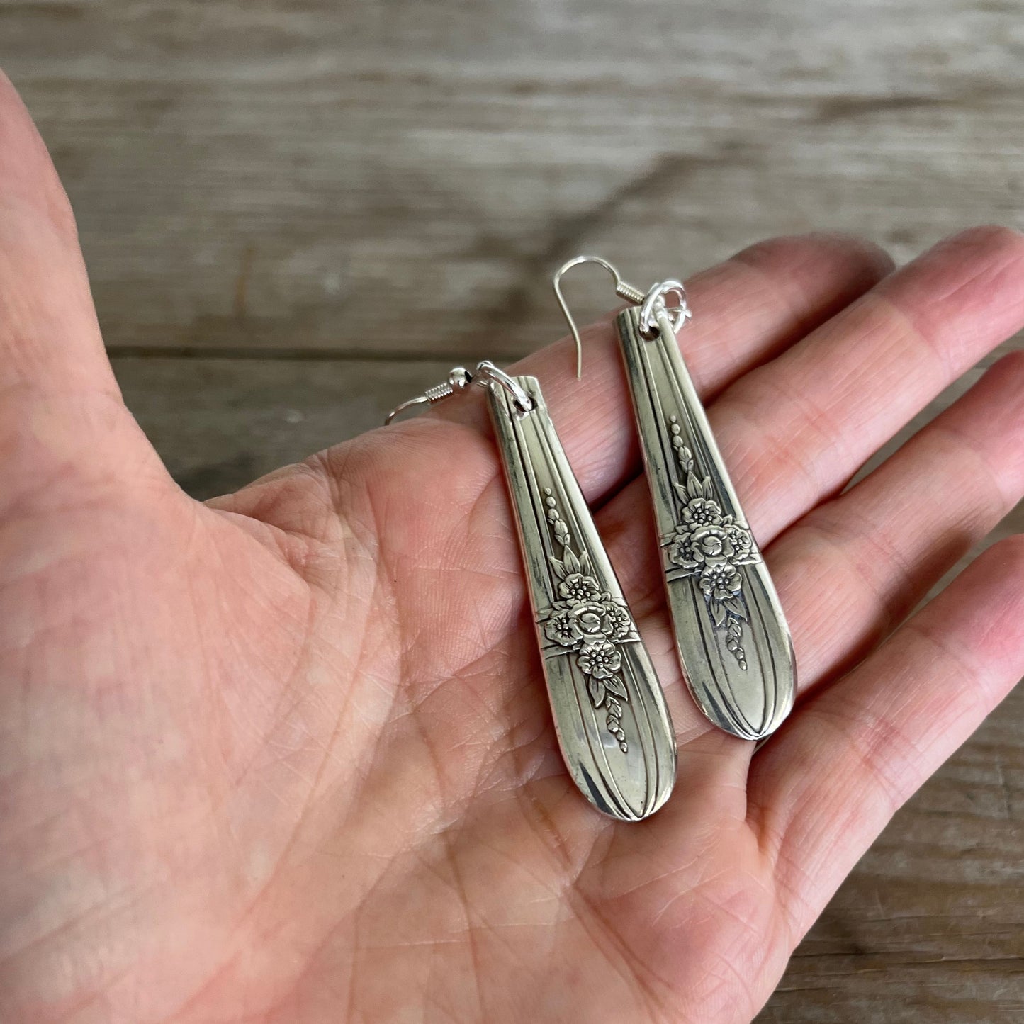 Spoon Earrings shown in hand for scale