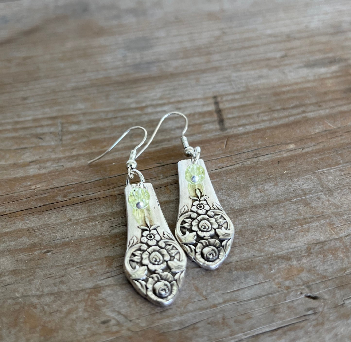 Close-up detail of tender floral nosegay motif on Plantation spoon handle earrings with chartreuse beads, one-of-a-kind 1948 pattern