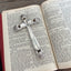 Upcycled knife cross Bible page weight - Eternally Yours pattern vintage silverware - shown in use