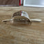 Handcrafted hair barrette from vintage cake server showing dimensional design