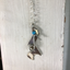 Spoon Artisan Necklace in the shape of a Quarter Rest and Eighth Note Musical Symbols Shown Hanging
