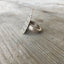 Side close-up of stamped art statement spoon ring - handcrafted upcycled silverware