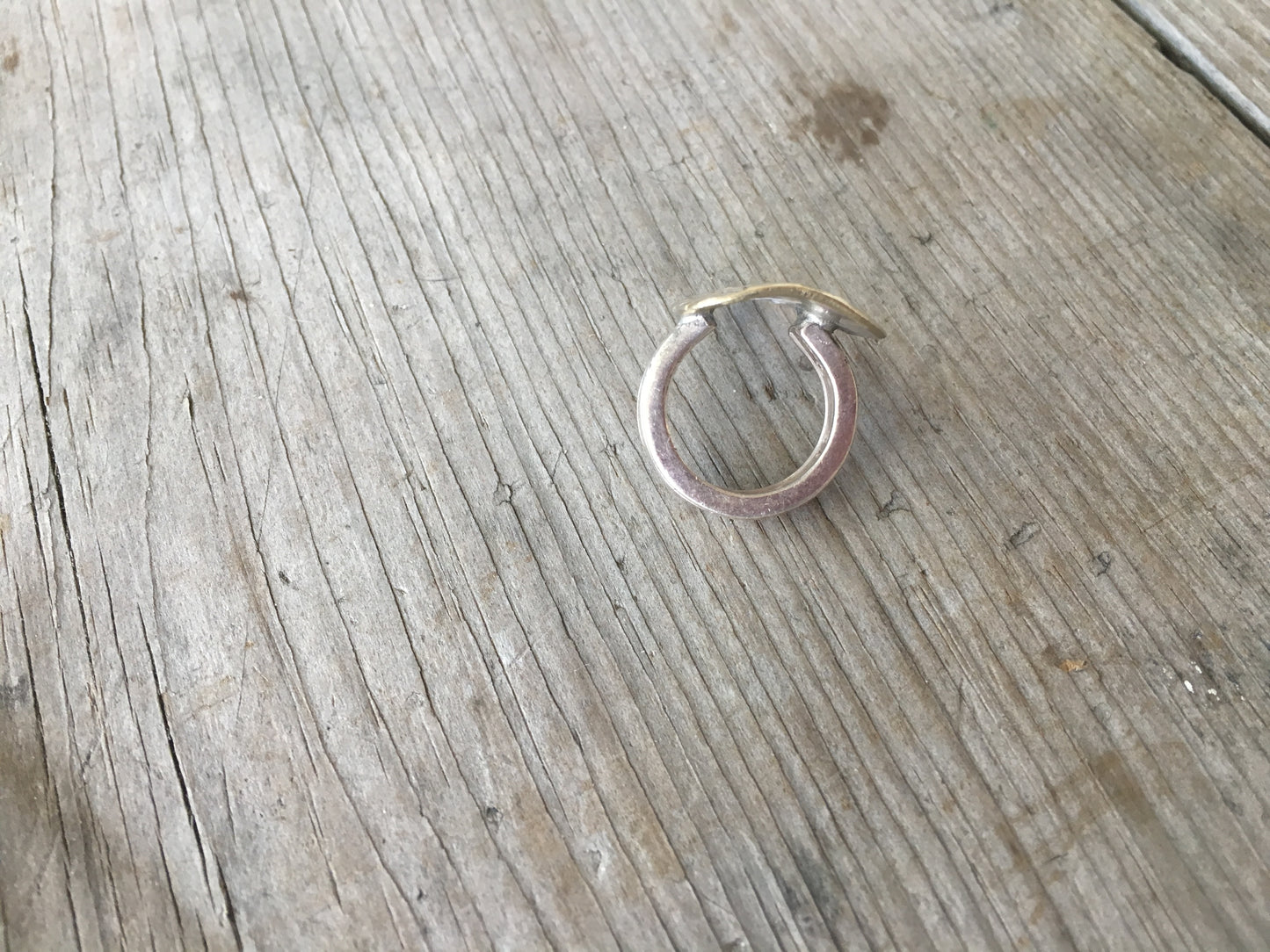 Top view of statement spoon ring featuring stamped art design - artisan silverware