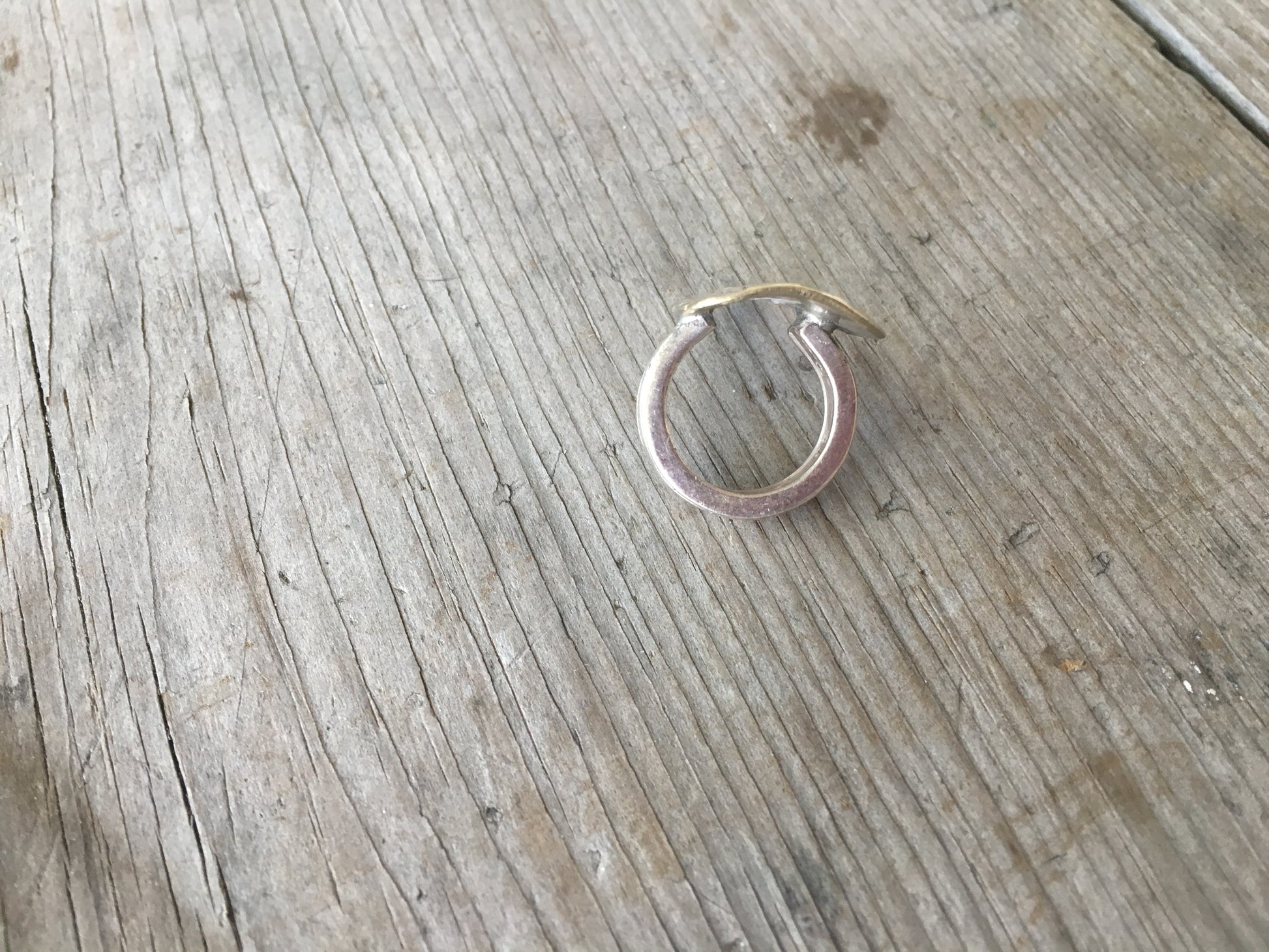 Top view of statement spoon ring featuring stamped art design - artisan silverware