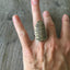 Statement spoon ring with stamped art design shown on hand - handcrafted upcycled silverware jewelry