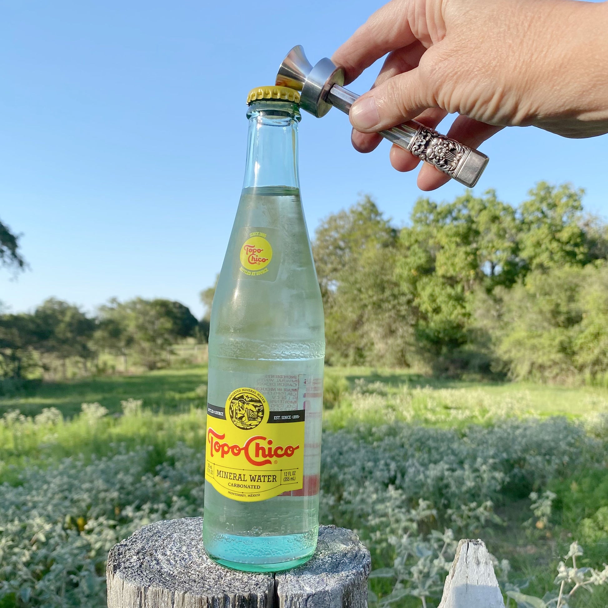 Handmade Grand Elegance knife handle bottle opener in use - upcycled vintage silverware bar cart accessory