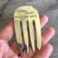 Handcrafted vintage fork bookmark stamped CARPE LIBRUM - close-up detail view