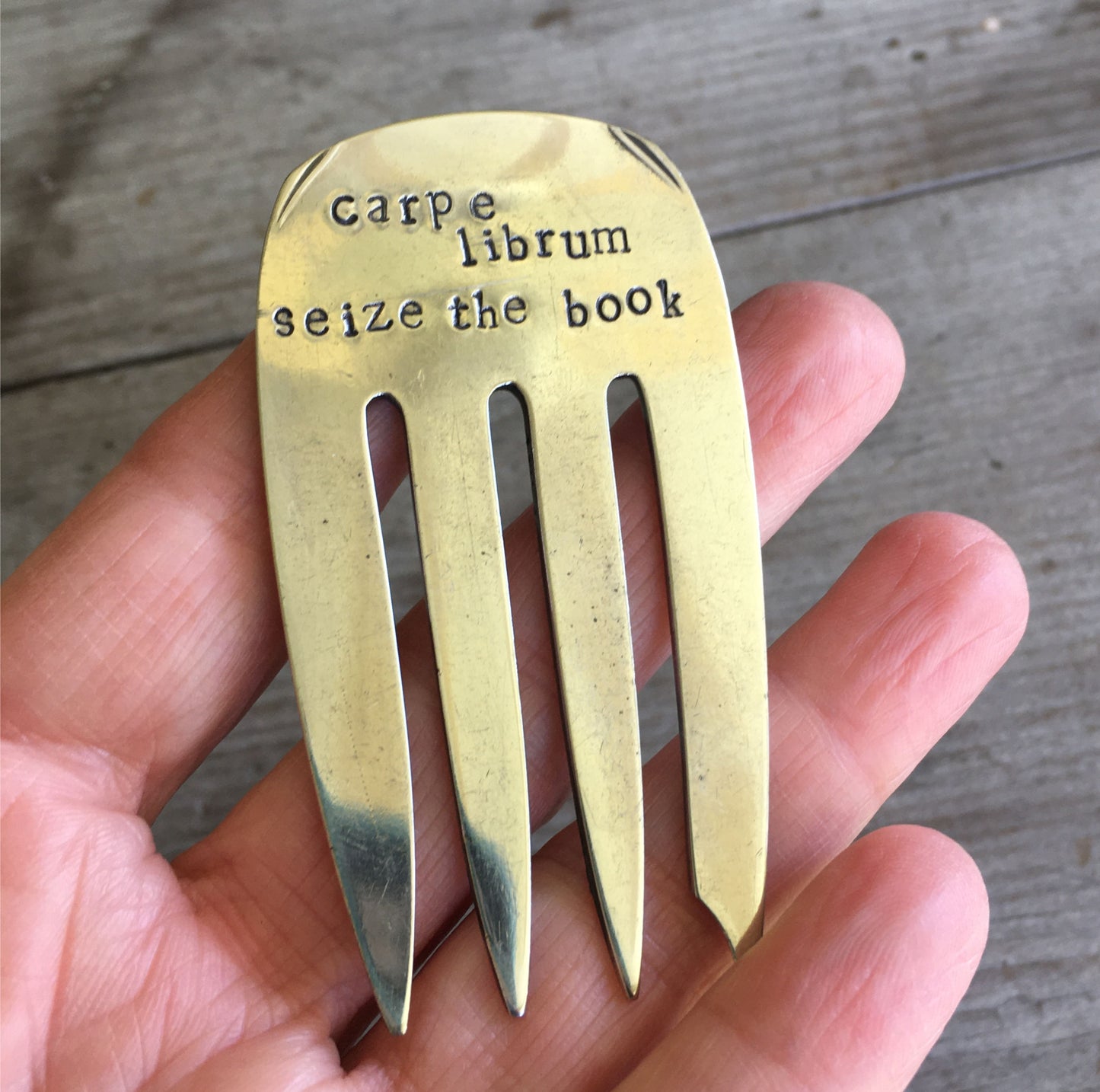 Handcrafted vintage fork bookmark stamped CARPE LIBRUM - close-up detail view