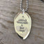 Close up of handstamped COFFEE WEEKENDS & LAKE DAYS with steaming coffee mug, spoon pendant on ball chain