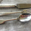 Hand-stamped vintage silverware set showing custom personalization - unique mismatched fork knife spoon gift