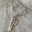 Close-up of hand-stamped silverplate spoon handle bars on Cherish Necklace, customizable personalized gift for mothers and grandmothers