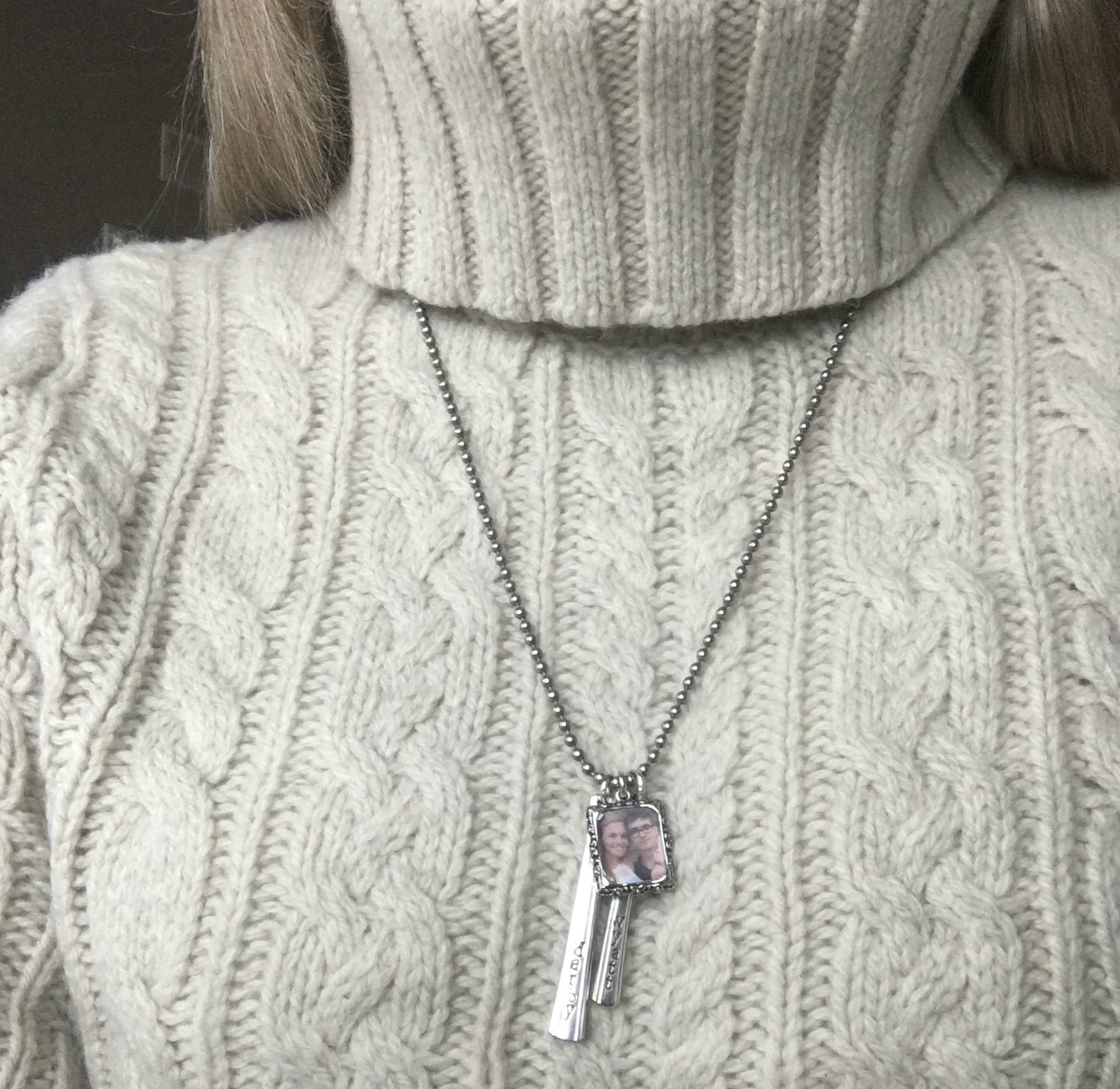 Cherish Necklace styled showing expandable vertical bar design with photo frame, one-of-a-kind upcycled silverware keepsake necklace for Mom