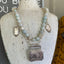 Artisan handcrafted 1920s belt buckle necklace featuring turquoise magnesite beads - unique upcycled silverware jewelry