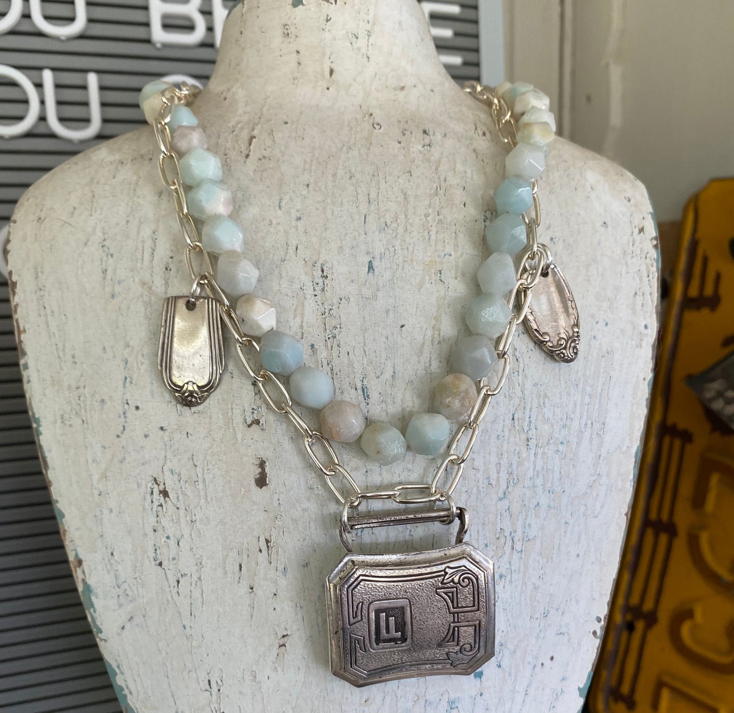 Artisan handcrafted 1920s belt buckle necklace featuring turquoise magnesite beads - unique upcycled silverware jewelry