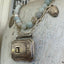 Detailed view of handmade belt buckle necklace with turquoise magnesite beads and vintage silverware bits - eco-friendly jewelry