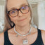 Upcycled 1920s belt buckle statement necklace with turquoise beads modeled - handcrafted vintage silverware artisan jewelry