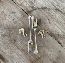 Forks before and after being made into elephant pins