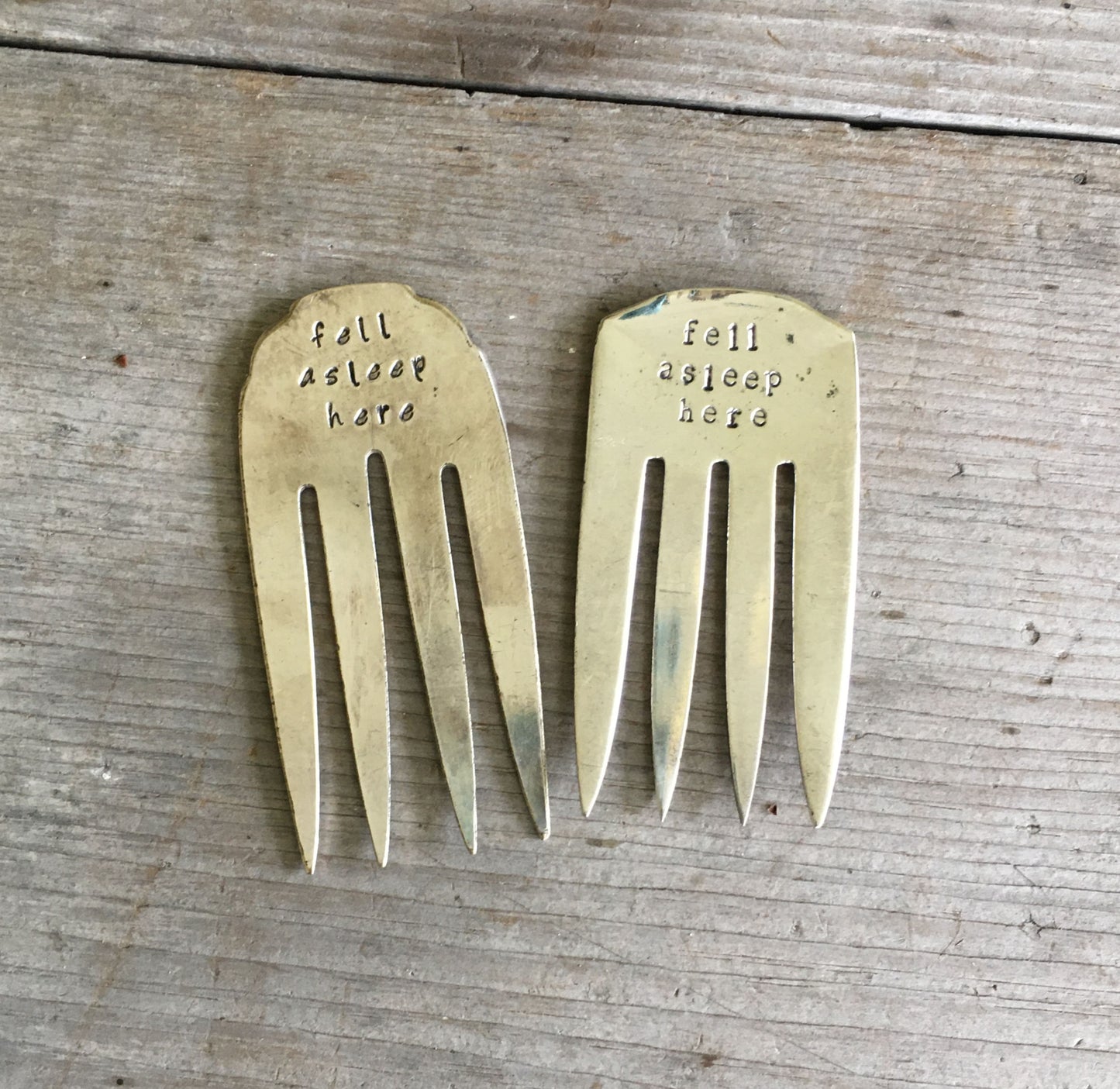 Collection of handcrafted fork bookmarks stamped FELL ASLEEP HERE showing vintage silverware variations