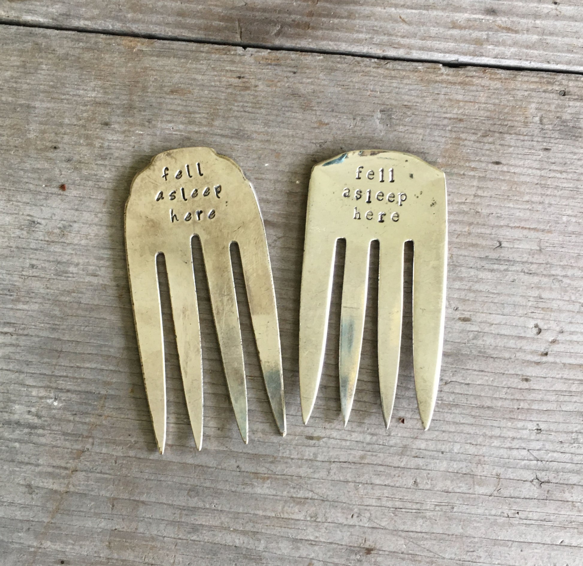 Collection of handcrafted fork bookmarks stamped FELL ASLEEP HERE showing vintage silverware variations