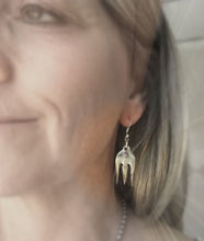 Upcycled cocktail fork earrings shown on model