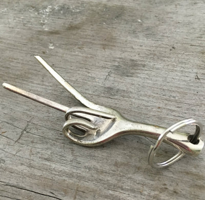 Side view of Key chain upcycled from a fork into the shape of a hand give the peace sign hand gesture