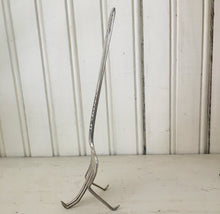 Side view of hand stamped upcycled fork easel