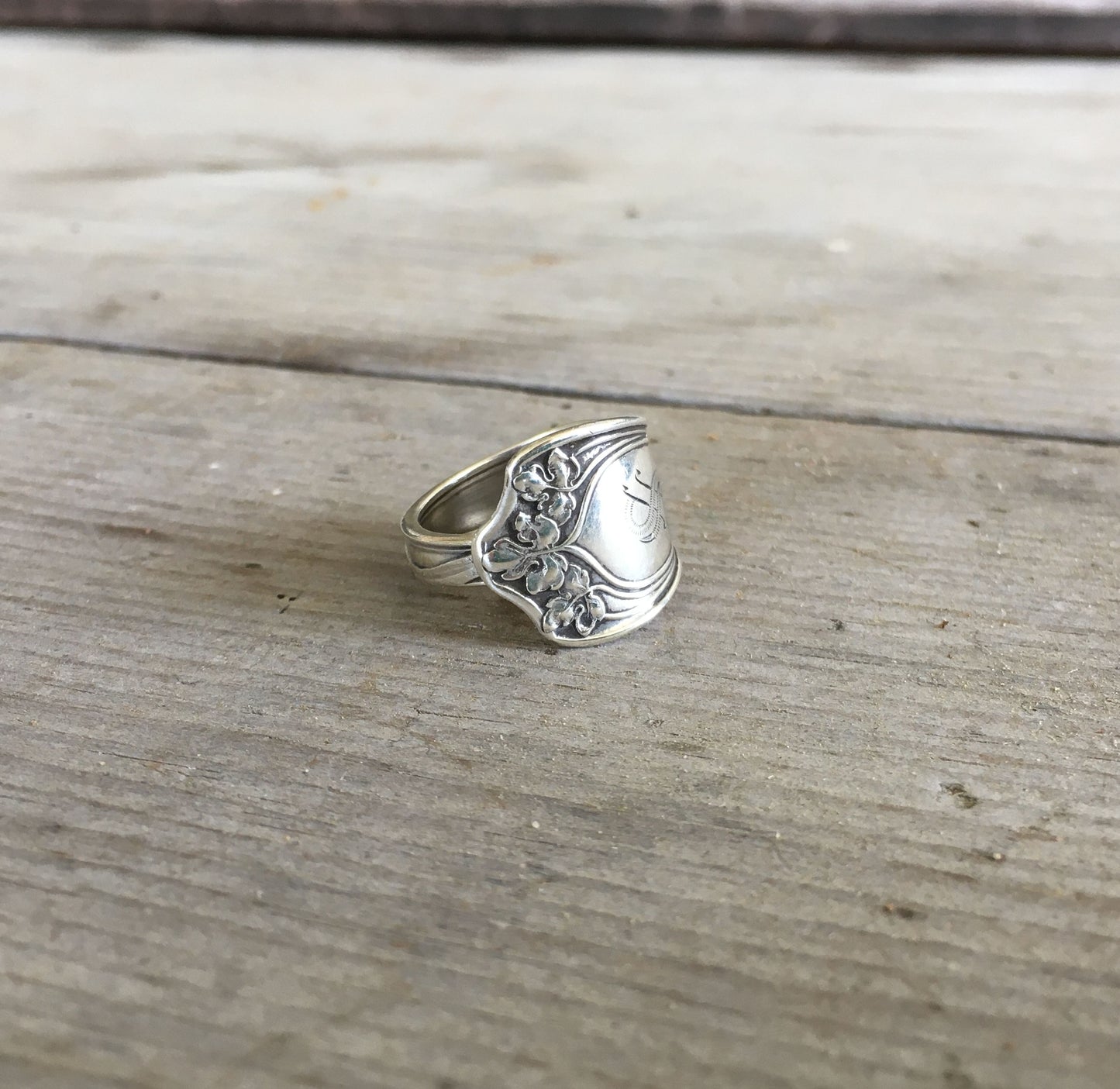Close-up of Gorham Vine pattern sterling silver ring showing ornate botanical design and monogram - Sterling spoon ring - handcrafted from upcycled vintage silverware - Laughing Frog Studio