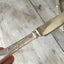 Close up of Stratford Silverplate Rosemary Dinner Knife upcycle into a sharp cheese charcuterie knife