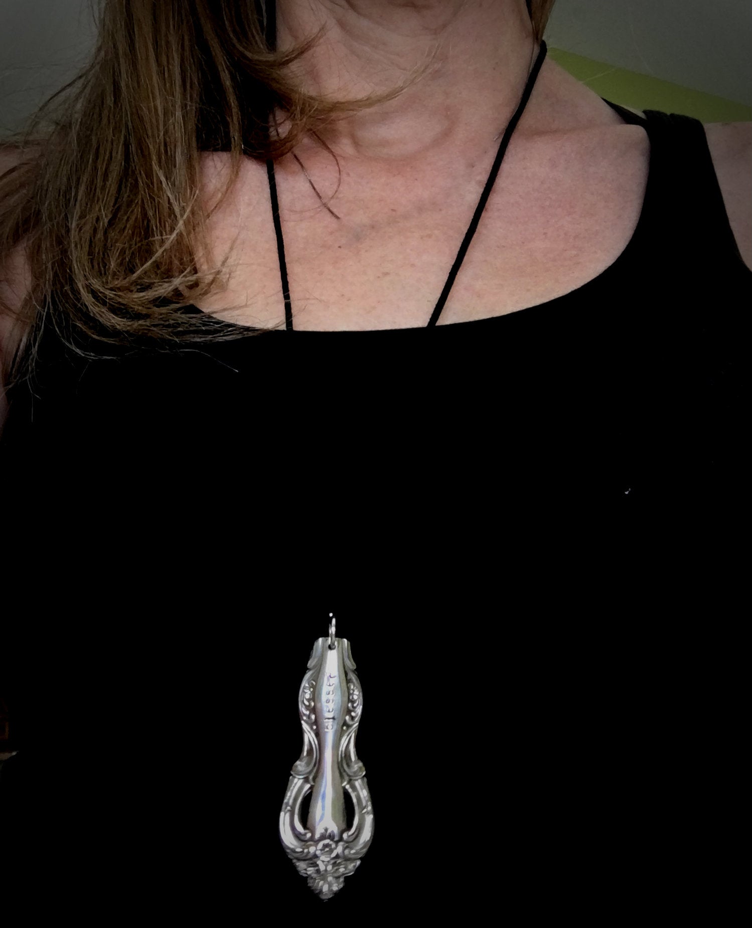 Long spoon handle necklace shown on model to illustrate length, size and scale