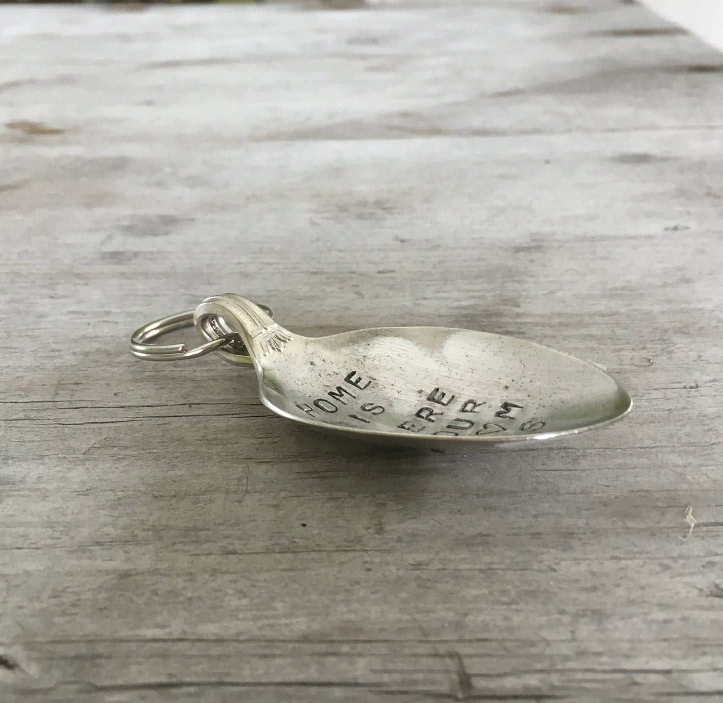 Side View of Spoon keychain hand stamped with HOME IS WHERE your mom is