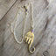 UPcycled silverware necklace in shape of an elephant with millefioiri bead