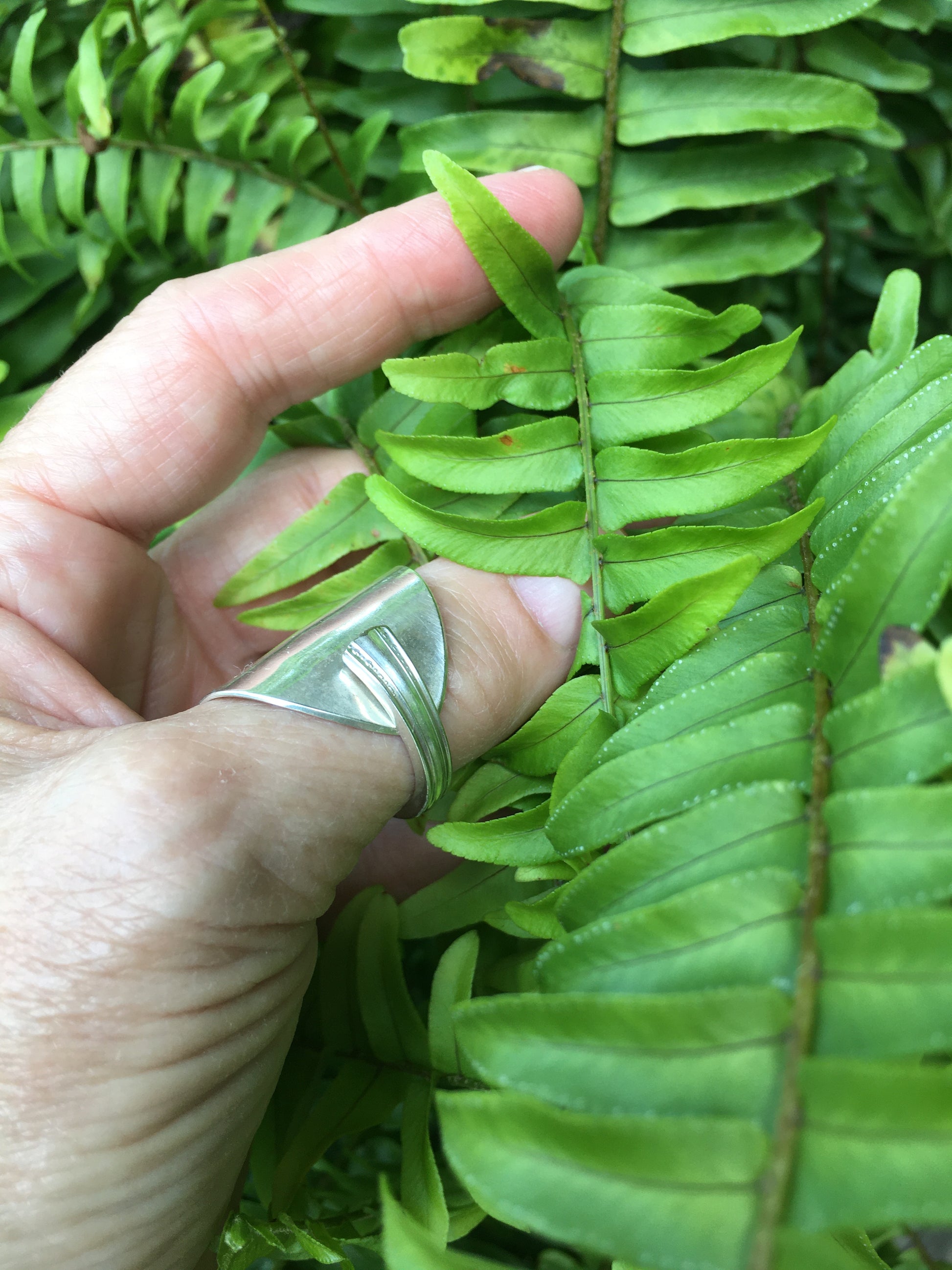 SHERATON spoon cuff ring worn on finger displaying size and fit of upcycled silverware ring as well as overlap design