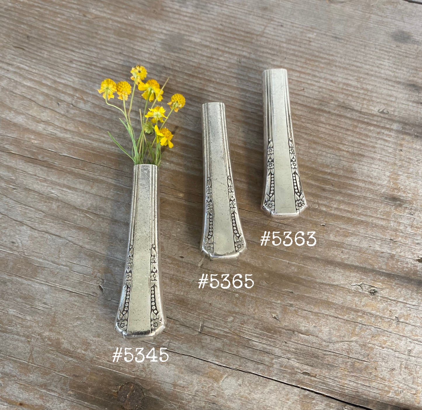 Handmade magnetic vase from antique Del Mar knife handle with fresh flowers 