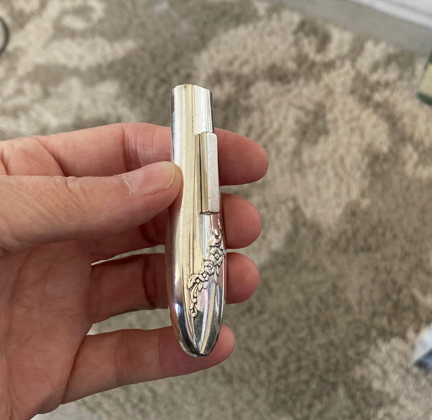 Side angle of handcrafted Queen Bess knife vase showing 1940s Art Deco curves and magnetic base
