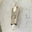 Underneath view of Knife Bell Necklace from Avalon Cabin Pattern accented with cultured pearls