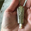 upcycled Knife Bell Necklace from Avalon Cabin Pattern shown in hand for size and scale