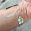 Mermaid Soul Upcycled Silverware Spoon Cuff Bracelet shown on model wrist